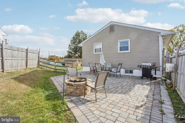 a view of a backyard with sitting area