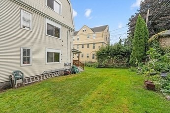 3 View Street, Unit 1 Worcester, MA 01610 - Photo 11 of 12 a view of a house with a yard and sitting area