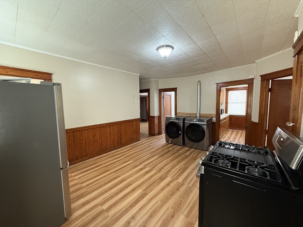 3 View Street, Unit 1 Worcester, MA 01610 - Photo 5 of 12 a bed room with a bed furniture and a flat tv screen