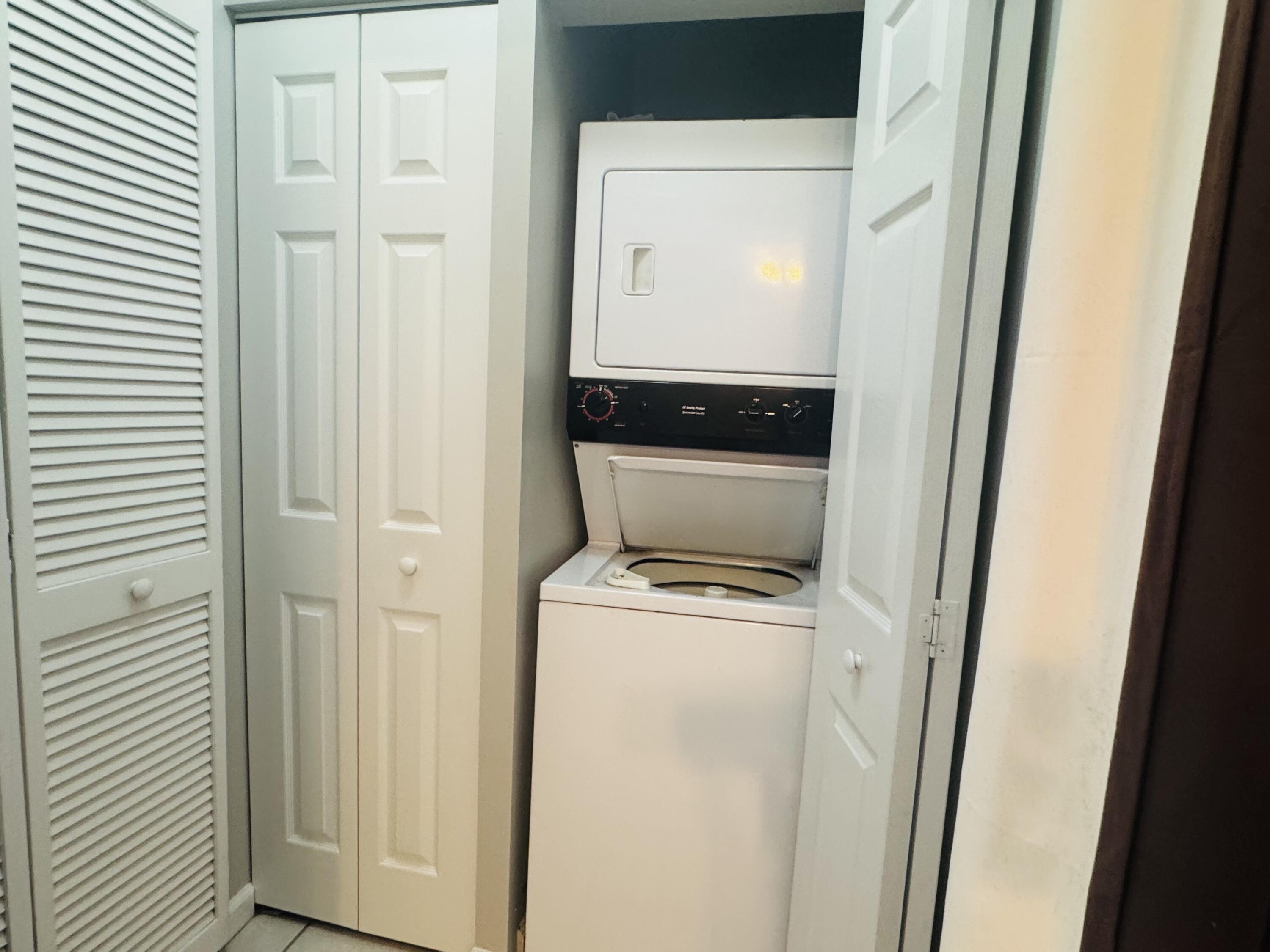 34 Heron's Watch Way, Unit 3202 Santa Rosa Beach, FL 32459 - Photo 11 of 15 a utility room with a washer and dryer