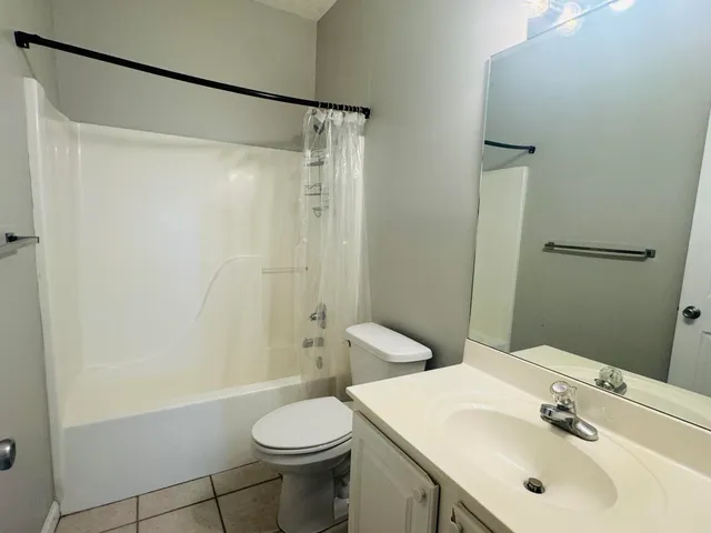 a view of empty room with windows