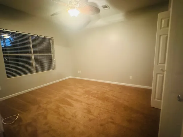 a bathroom with a shower a toilet and a sink