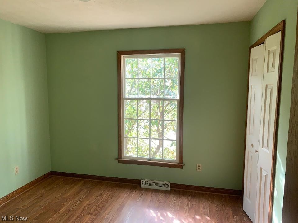 3997 Winchell Road Mantua, OH 44255 - Photo 14 of 29 Empty room featuring dark hardwood / wood-style flooring