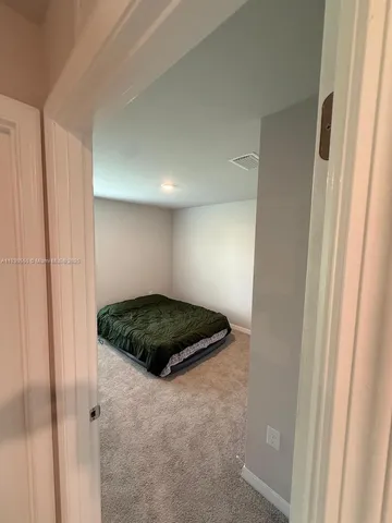 a bedroom with a bed and closet