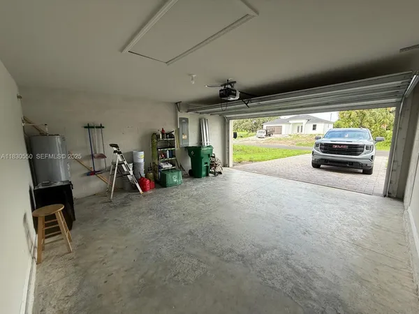 a view of backyard and utility room