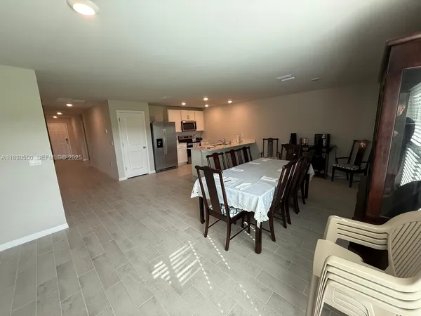 a view of a livingroom with furniture and window