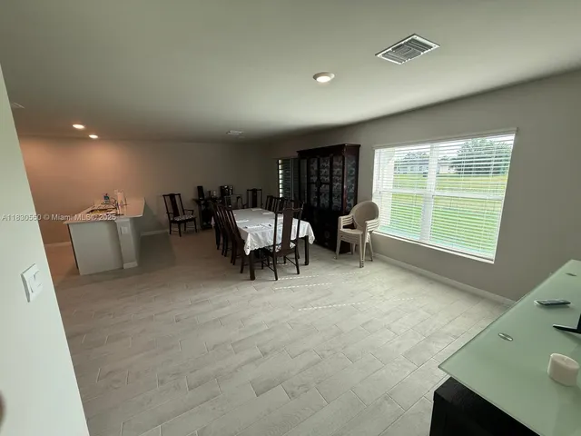 a kitchen with a stove a microwave and sink