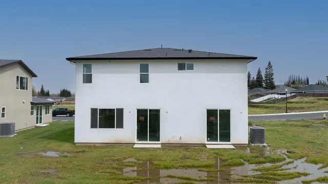 a house that has garden in front of it