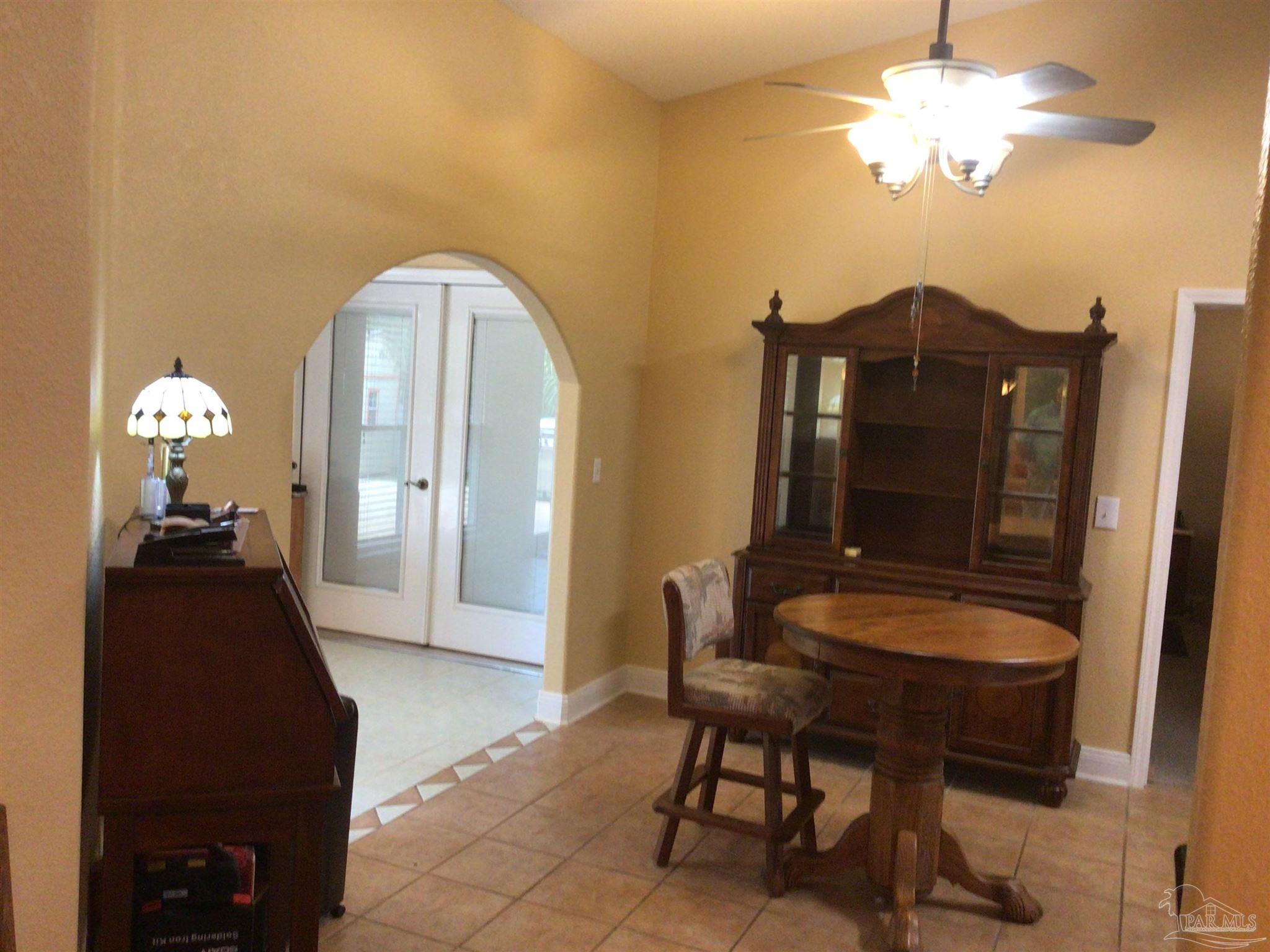 5668 Als Way Milton, FL 32583 - Photo 12 of 48 a view of a balcony with a table and chairs