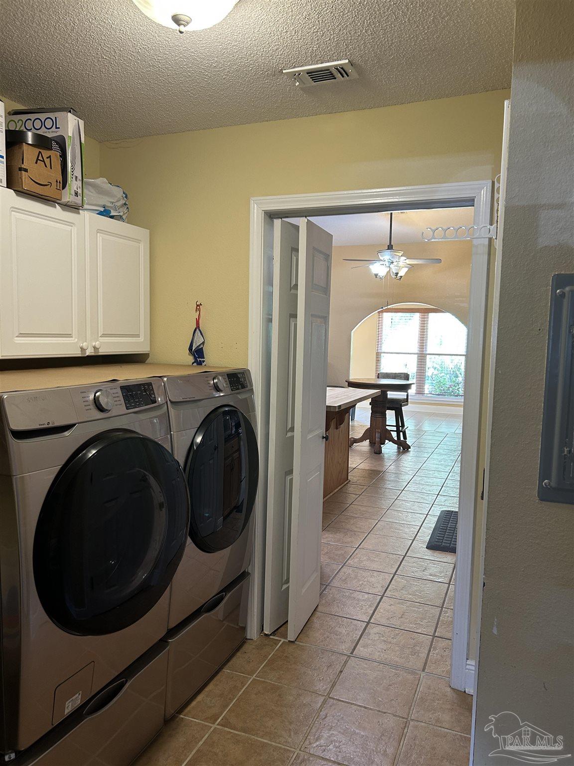 5668 Als Way Milton, FL 32583 - Photo 15 of 48 a view of a hallway with washer and dryer