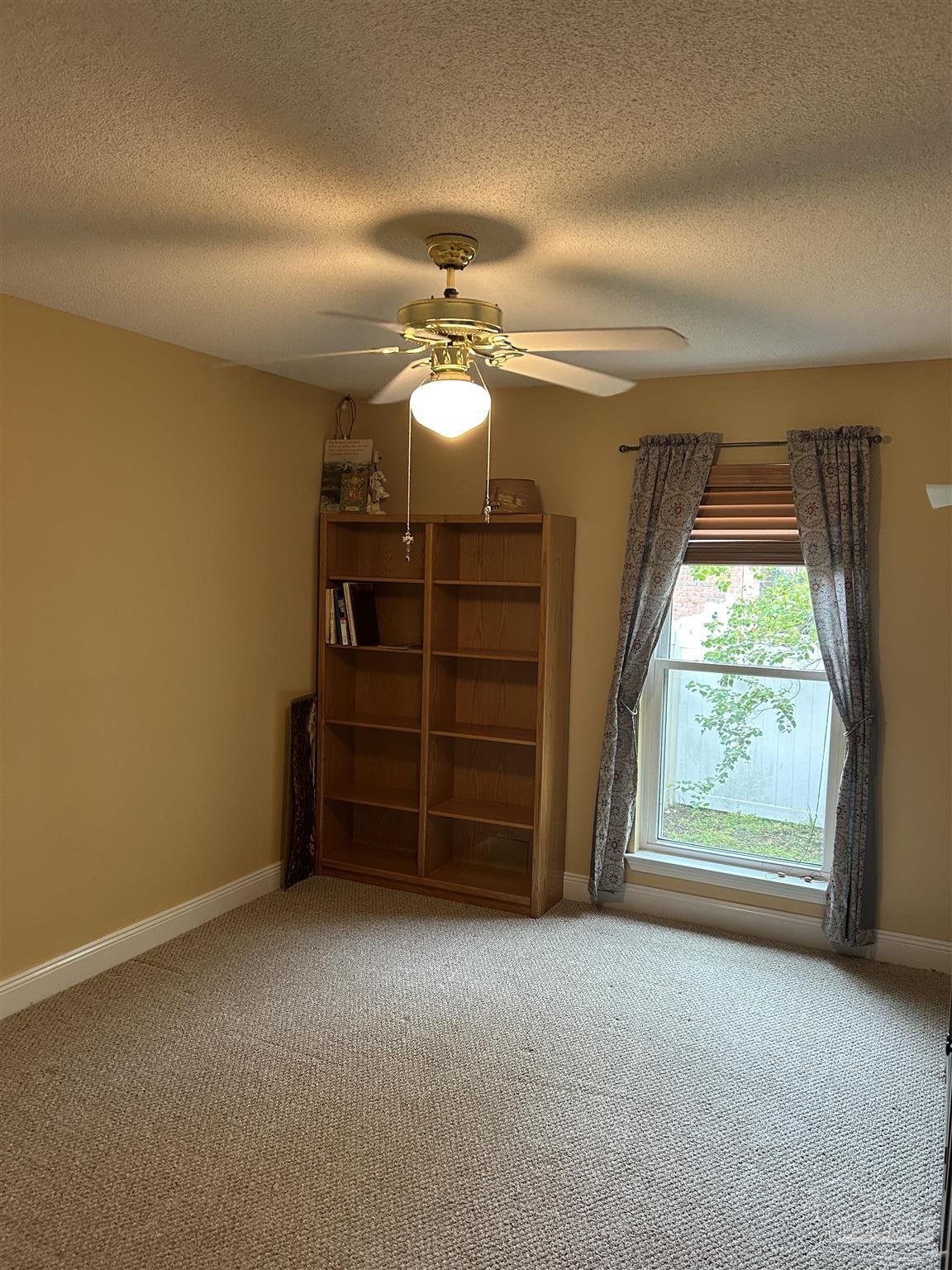 5668 Als Way Milton, FL 32583 - Photo 29 of 48 a view of an empty room with a window