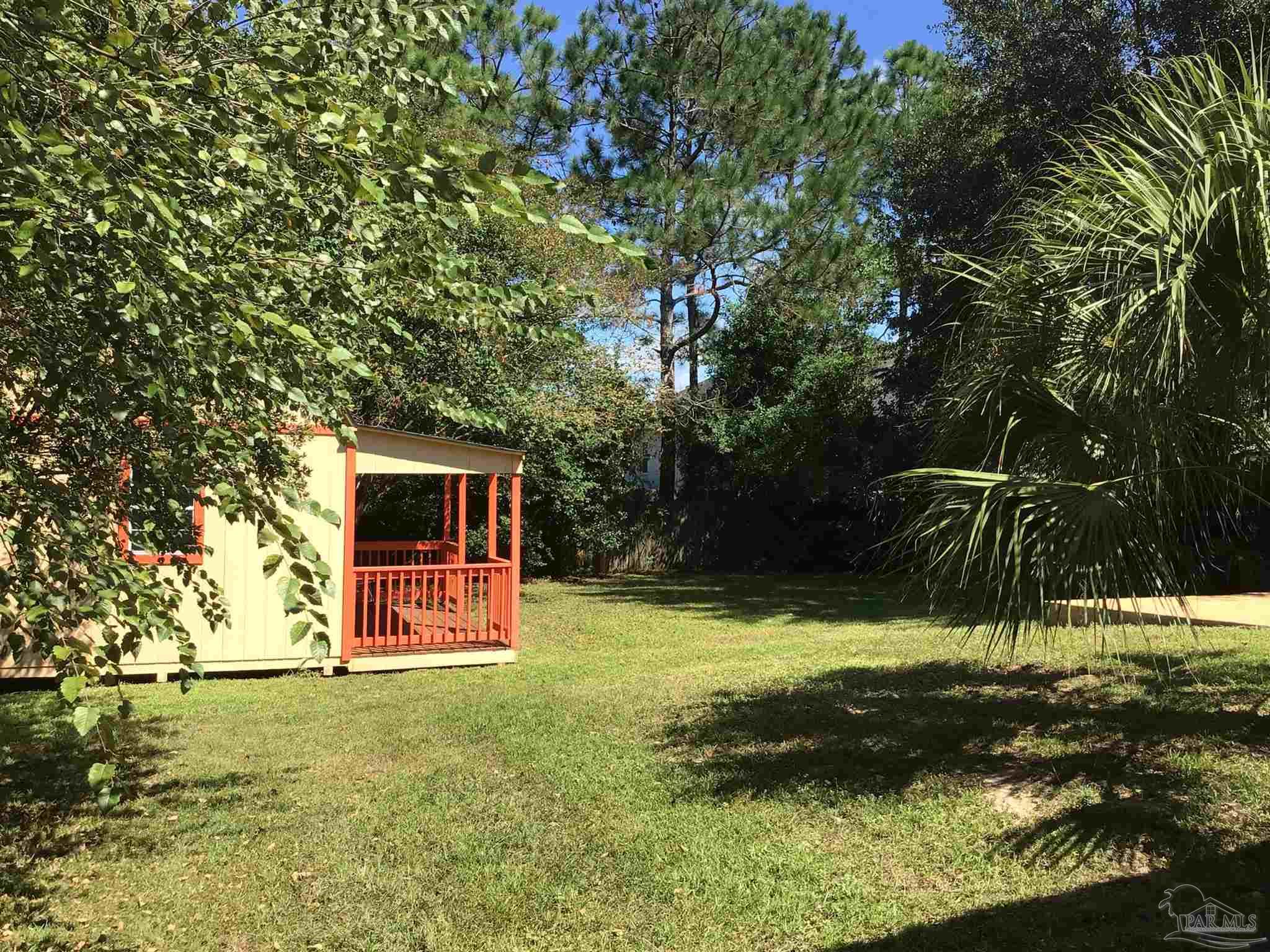 5668 Als Way Milton, FL 32583 - Photo 34 of 48 a backyard of a house with yard and trampoline