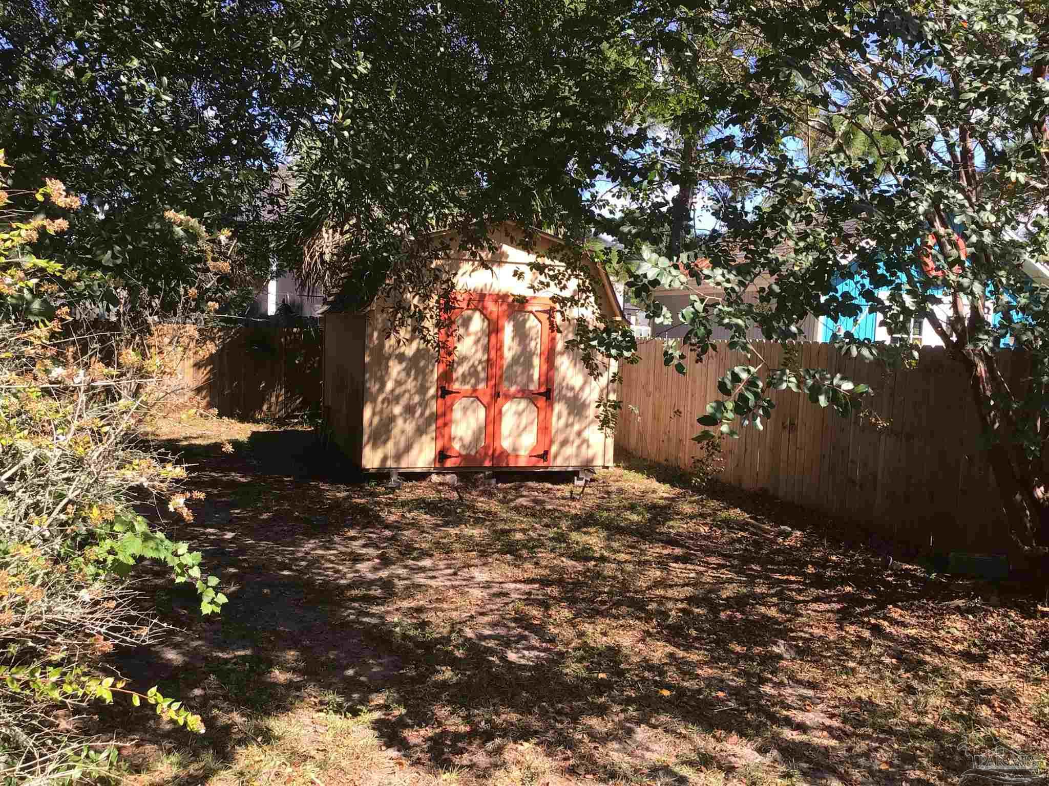 5668 Als Way Milton, FL 32583 - Photo 39 of 48 a view of a yard with a tree