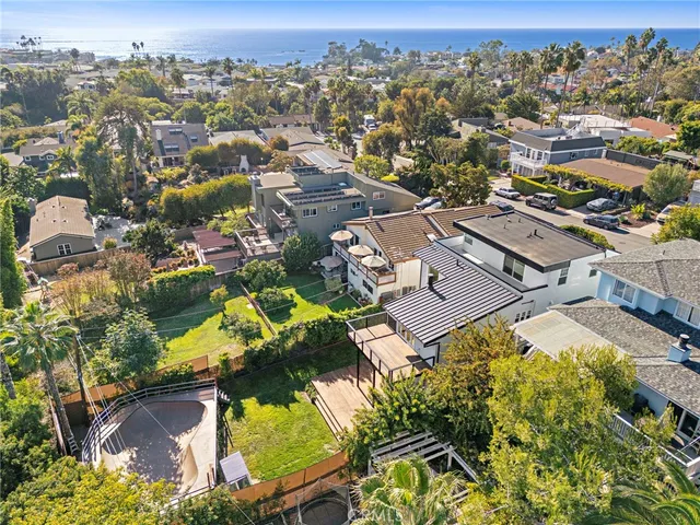 an aerial view of residential houses with outdoor space