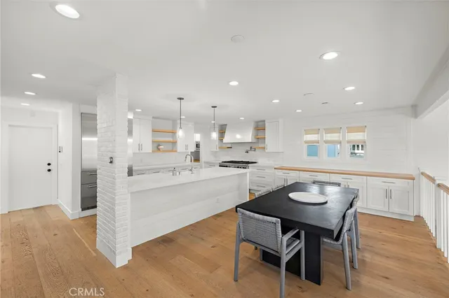 a kitchen with a table and chairs in it