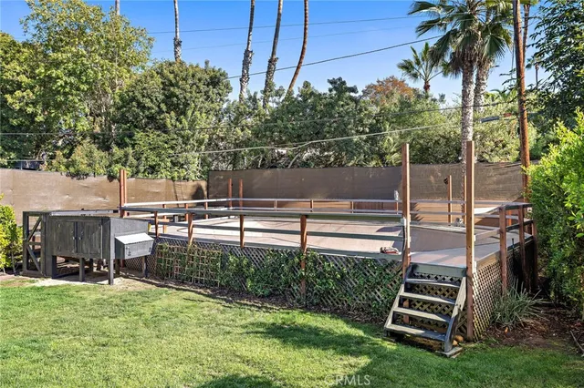 a view of a swimming pool with a patio