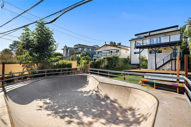 an aerial view of a house with yard swimming pool and outdoor seating