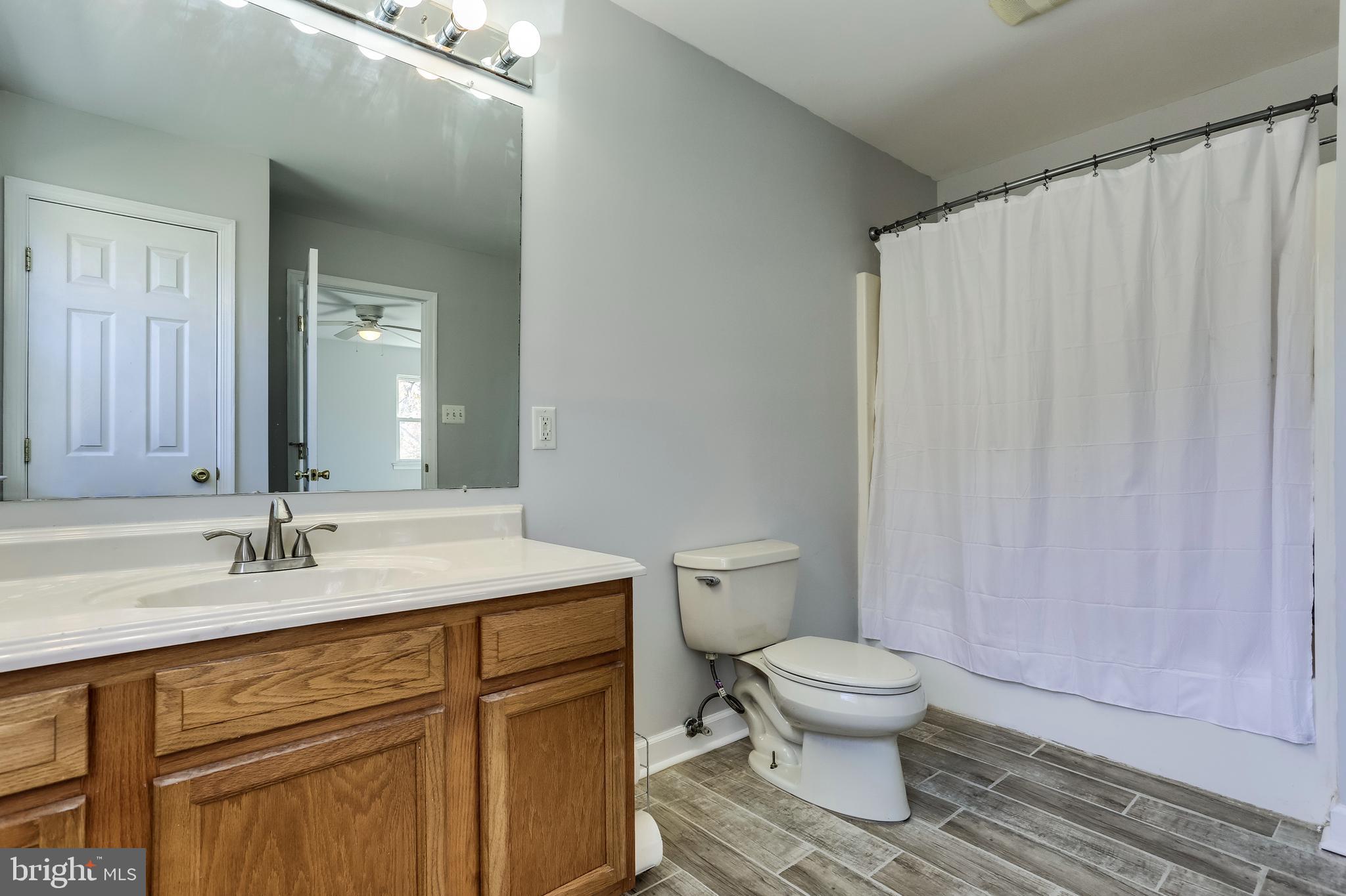 263 Hickory Point Road Pasadena, MD 21122 - Photo 18 of 33 bright Guest Bath new flooring