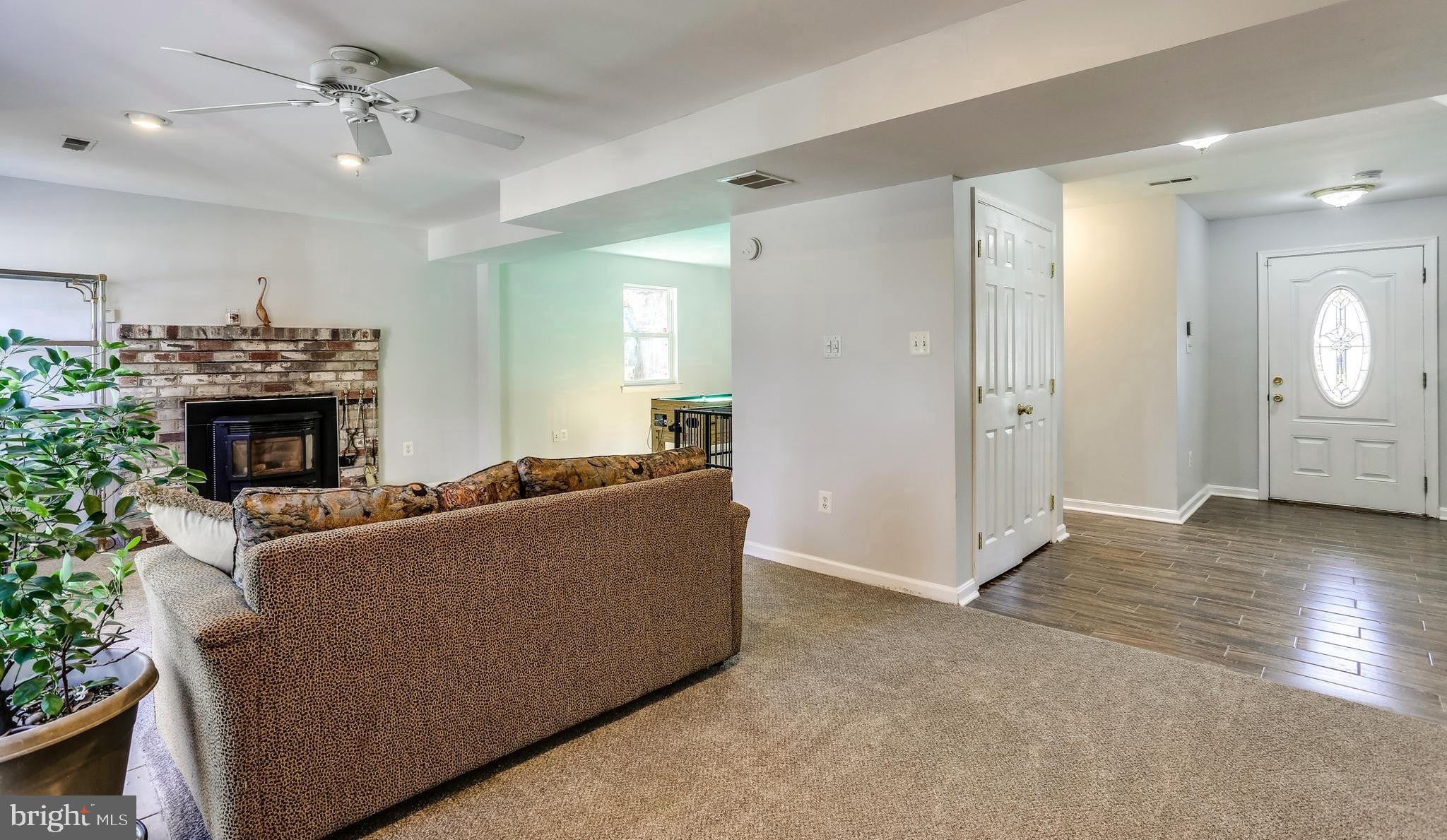 263 Hickory Point Road Pasadena, MD 21122 - Photo 4 of 33 Pellet fireplace wide Main Level Receiving Room