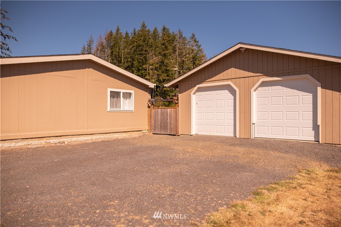 172 Fluckinger Road Toledo, WA 98591 - Photo 2 of 39 a view of a big room with windows and hallway