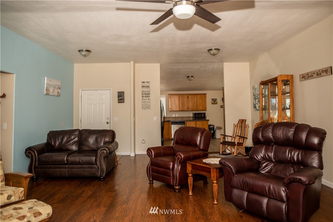 172 Fluckinger Road Toledo, WA 98591 - Photo 12 of 39 a living room with furniture and wooden floor