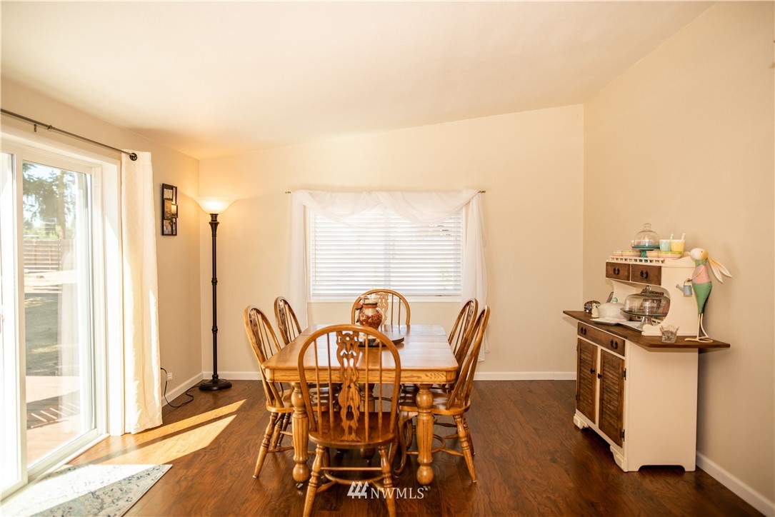 172 Fluckinger Road Toledo, WA 98591 - Photo 17 of 39 a view of a dining room with furniture and wooden floor