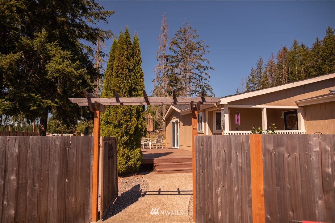172 Fluckinger Road Toledo, WA 98591 - Photo 9 of 39 a view of a house with a yard and wooden fence