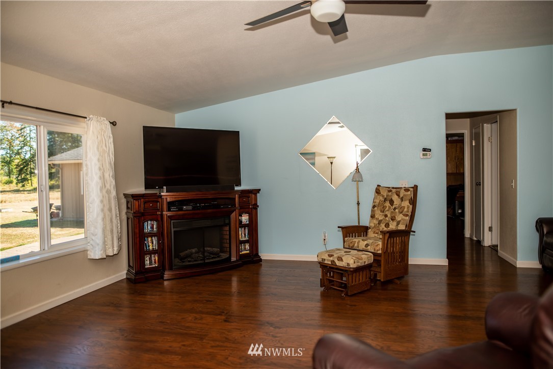 172 Fluckinger Road Toledo, WA 98591 - Photo 10 of 39 a living room with furniture and a flat screen tv