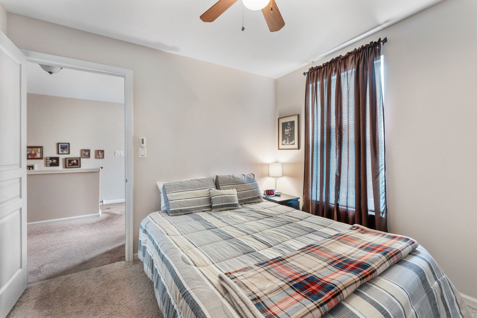 2539 Emily Lane Elgin, IL 60124 - Photo 10 of 15 a bedroom with a large bed and a chandelier