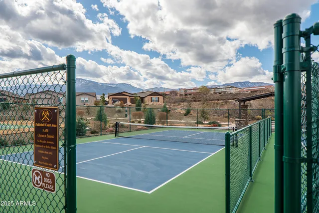 a view of a big yard with table and chairs