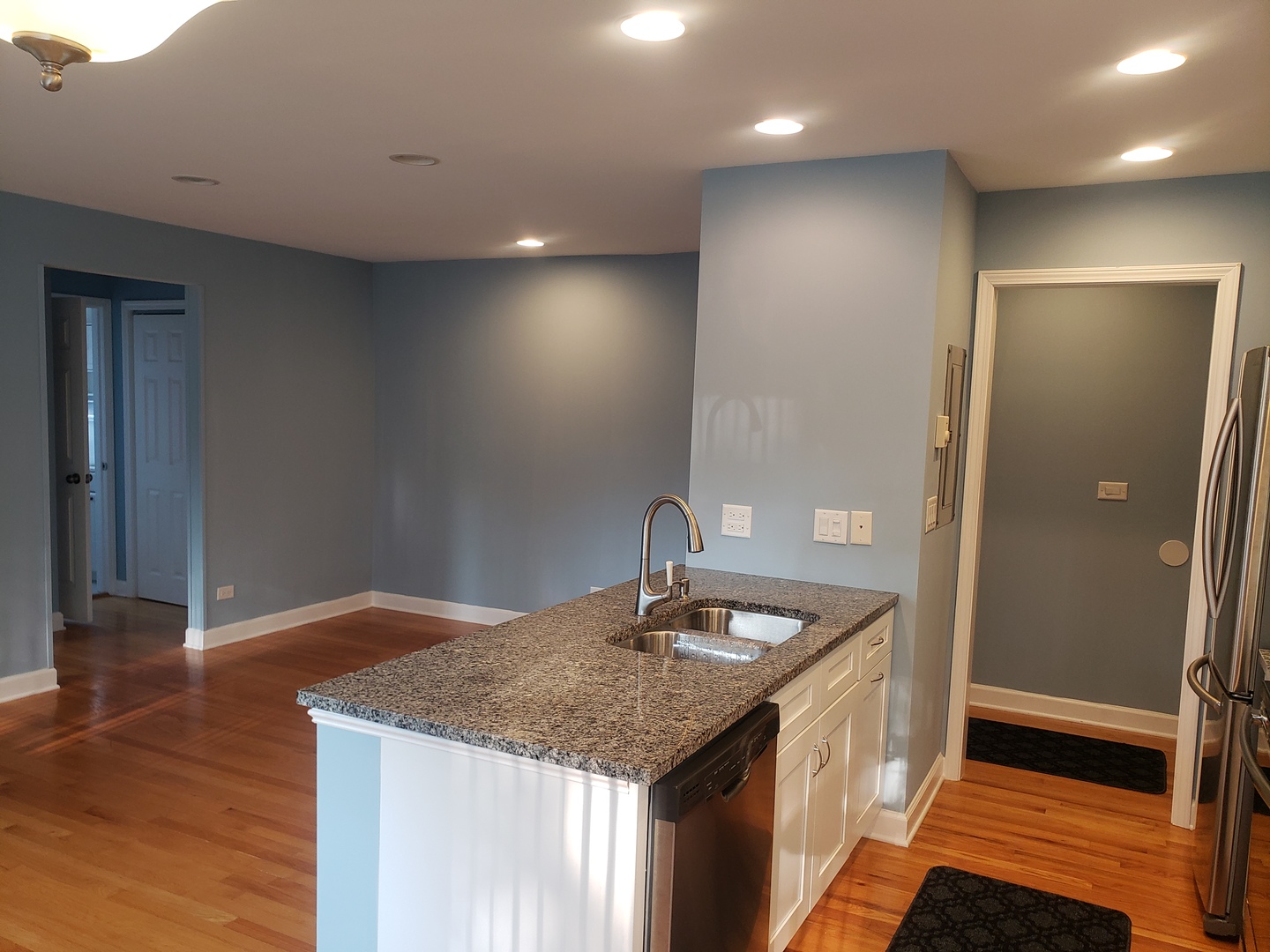705 Strom Drive, Unit 2A West Dundee, IL 60118 - Photo 2 of 13 a kitchen with a sink vanity and refrigerator