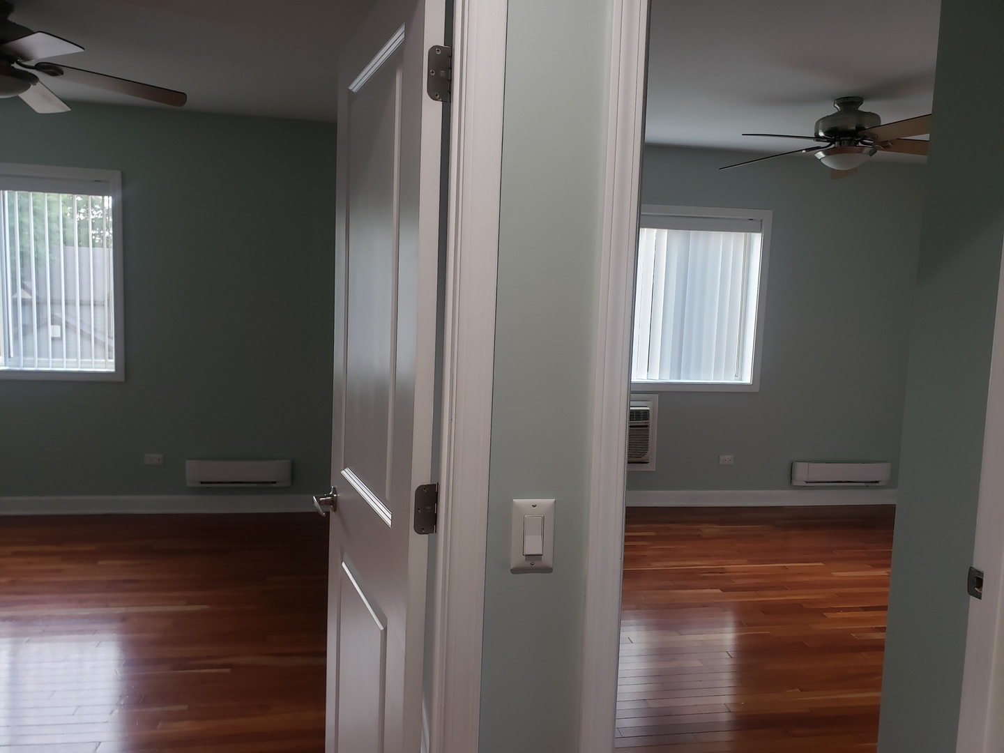 705 Strom Drive, Unit 2A West Dundee, IL 60118 - Photo 8 of 13 a view of empty room with window and wooden floor