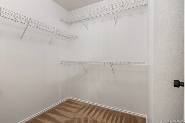 a view of a room with racks on the wall
