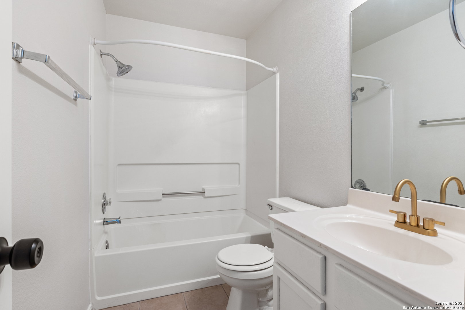 5211 Stormy Autumn San Antonio, TX 78247 - Photo 17 of 24 a bathroom with a sink toilet and shower