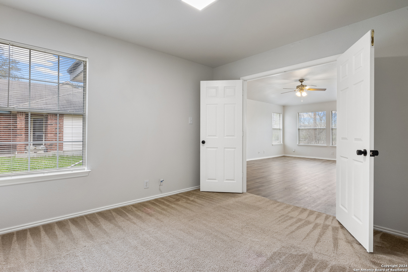 5211 Stormy Autumn San Antonio, TX 78247 - Photo 19 of 24 wooden floor in an empty room with a window