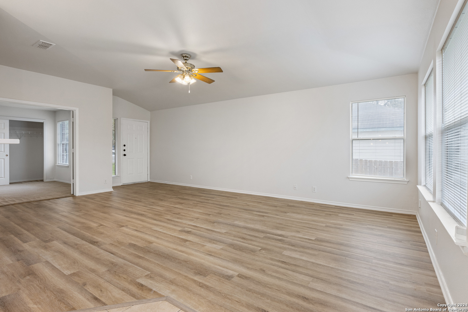 5211 Stormy Autumn San Antonio, TX 78247 - Photo 5 of 24 a view of empty room with wooden floor and fan