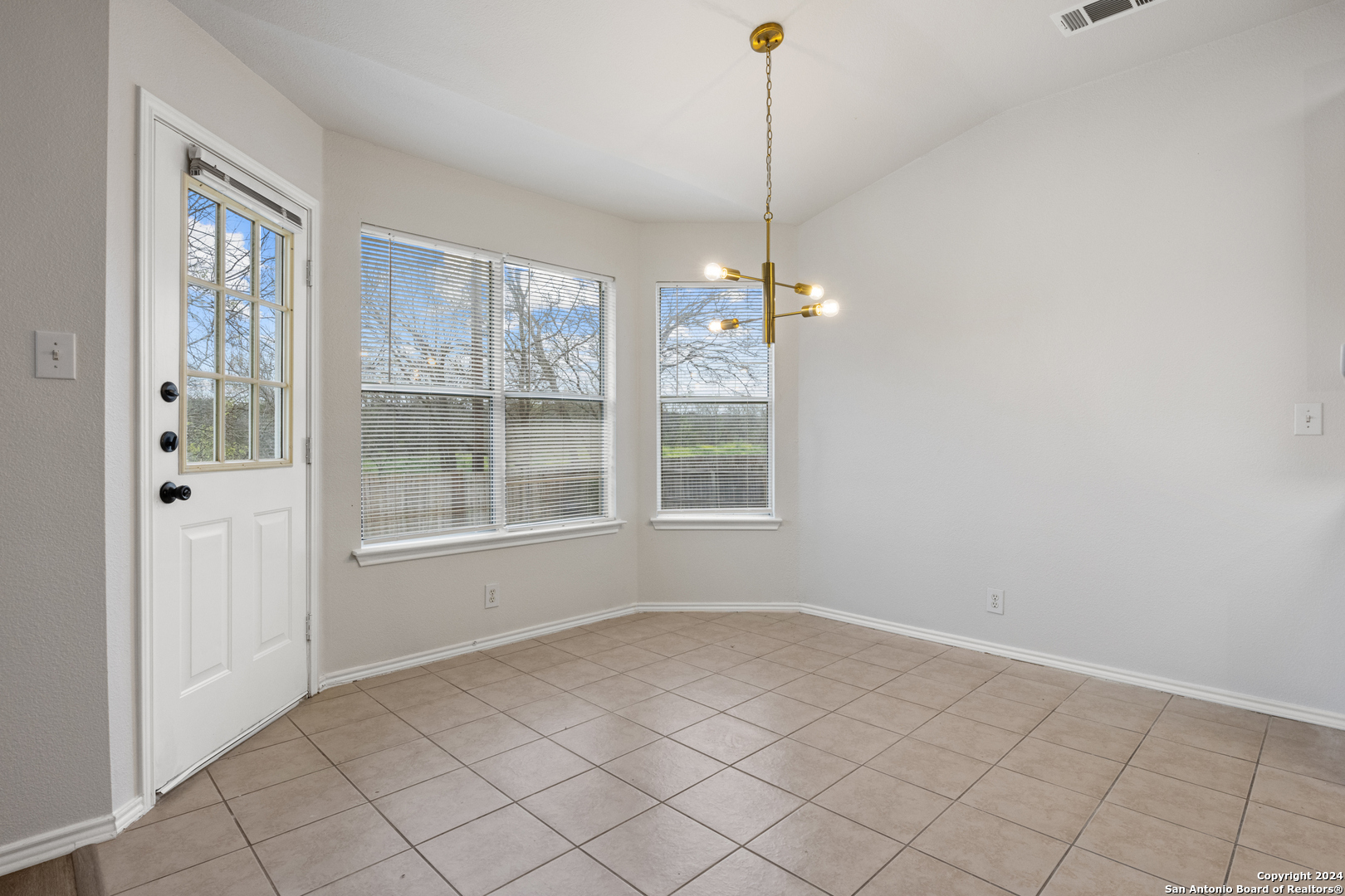 5211 Stormy Autumn San Antonio, TX 78247 - Photo 6 of 24 a view of an empty room with windows