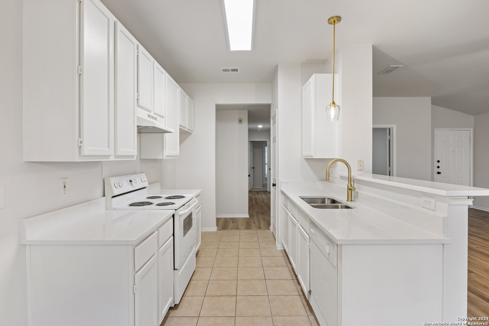 5211 Stormy Autumn San Antonio, TX 78247 - Photo 7 of 24 a kitchen with stainless steel appliances a sink stove and cabinets