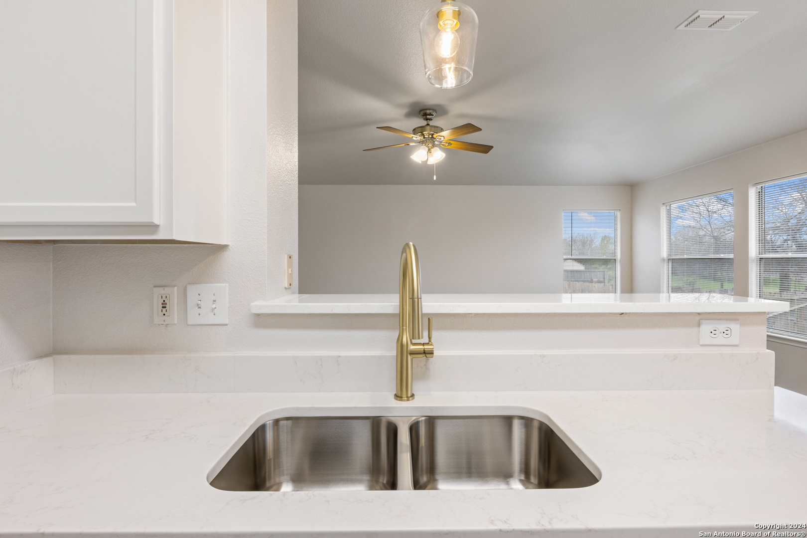 5211 Stormy Autumn San Antonio, TX 78247 - Photo 8 of 24 a kitchen with a sink and a window