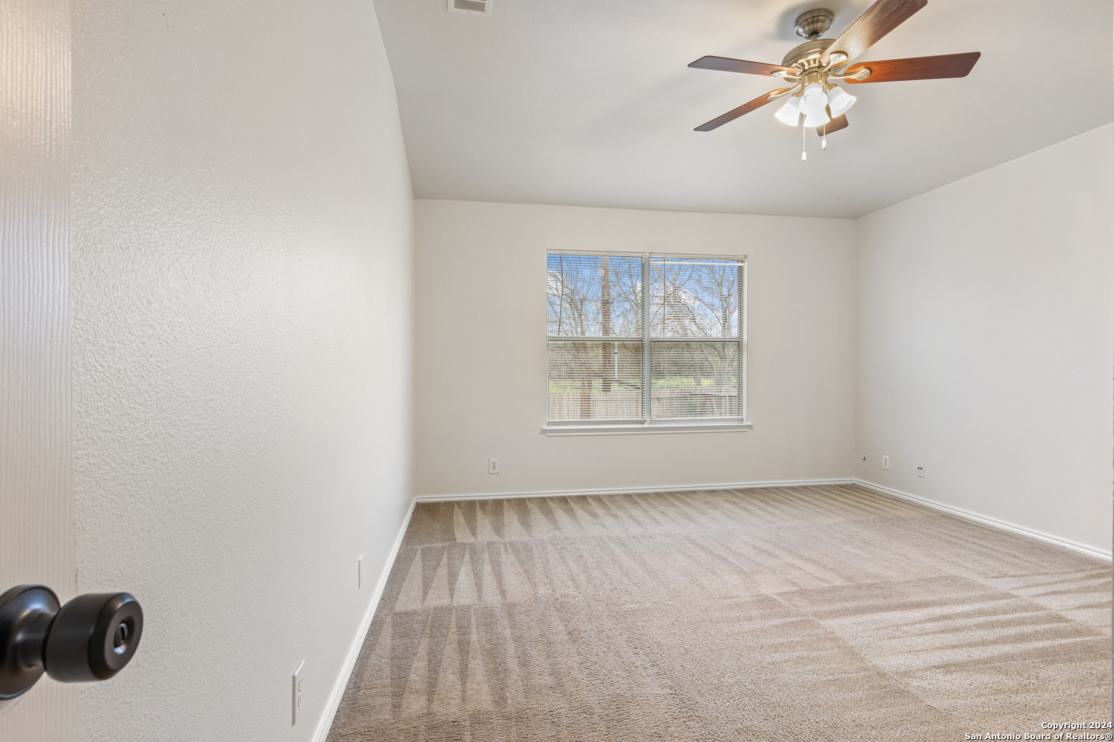 5211 Stormy Autumn San Antonio, TX 78247 - Photo 10 of 24 a view of an empty room with a window