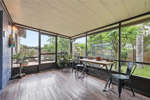a room with wooden floor and furniture