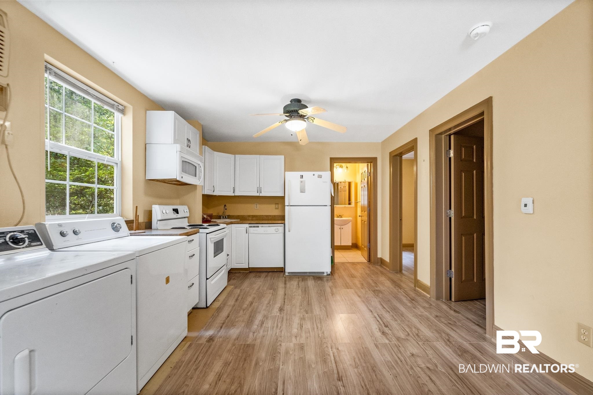 8321 Dixon Road Bay Minette, AL 36507 - Photo 59 of 79 Laundry area featuring ceiling fan, independent washer and dryer, and light hardwood / wood-style floors