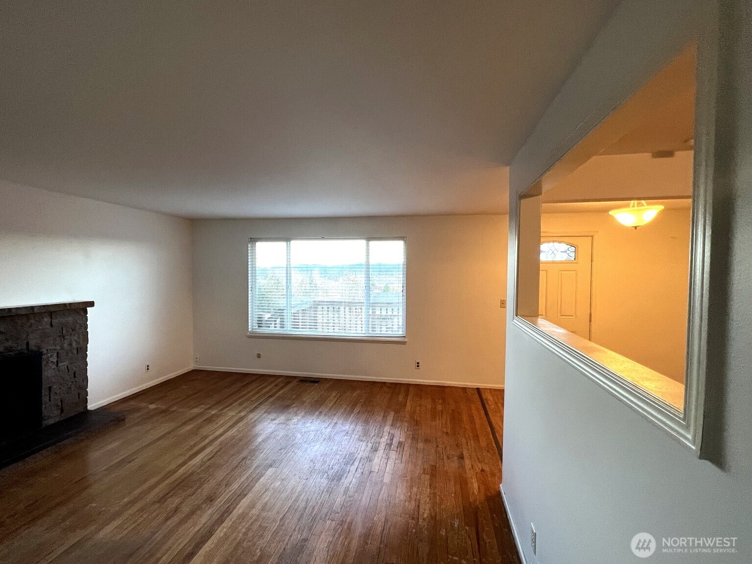 17930 Military Road South SeaTac, WA 98188 - Photo 11 of 19 an empty room with wooden floor and windows