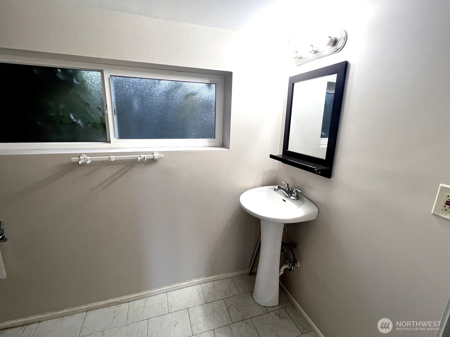 17930 Military Road South SeaTac, WA 98188 - Photo 12 of 19 a bathroom with a sink a mirror and a toilet