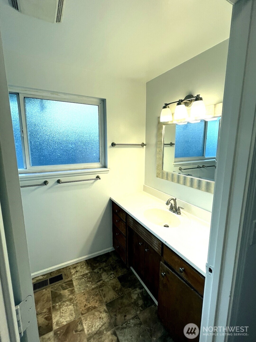 17930 Military Road South SeaTac, WA 98188 - Photo 13 of 19 a bathroom with a sink and a mirror