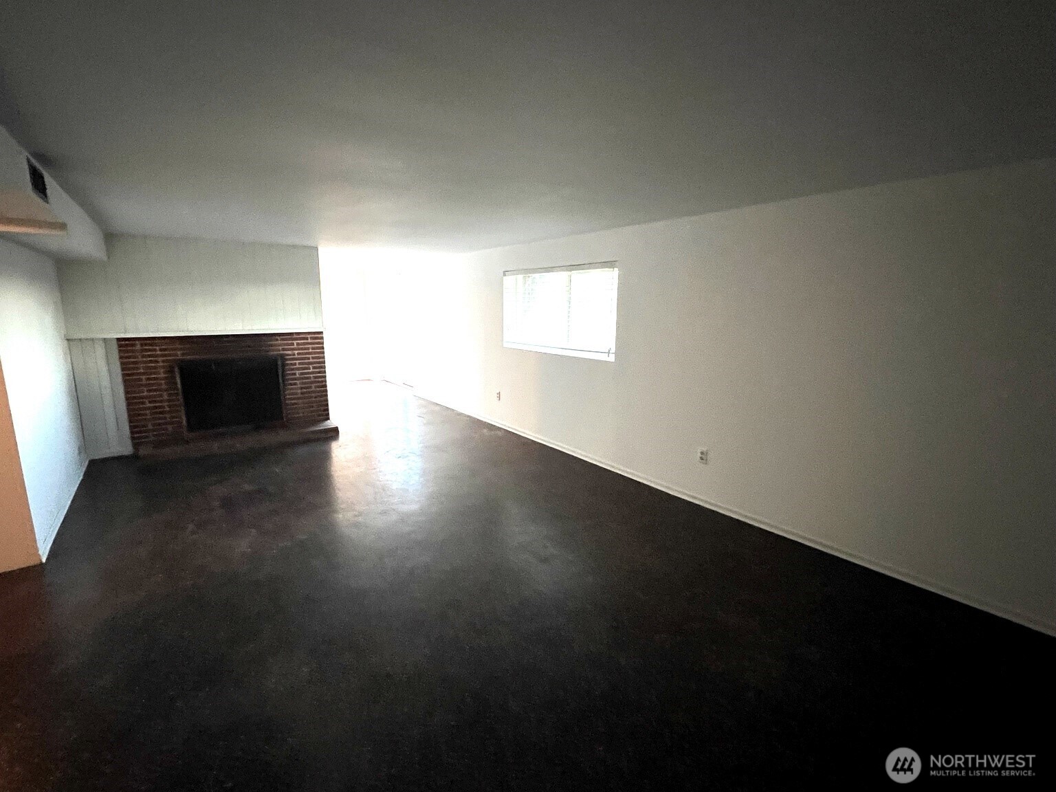 17930 Military Road South SeaTac, WA 98188 - Photo 17 of 19 a view of an empty room with wooden floor and a fireplace