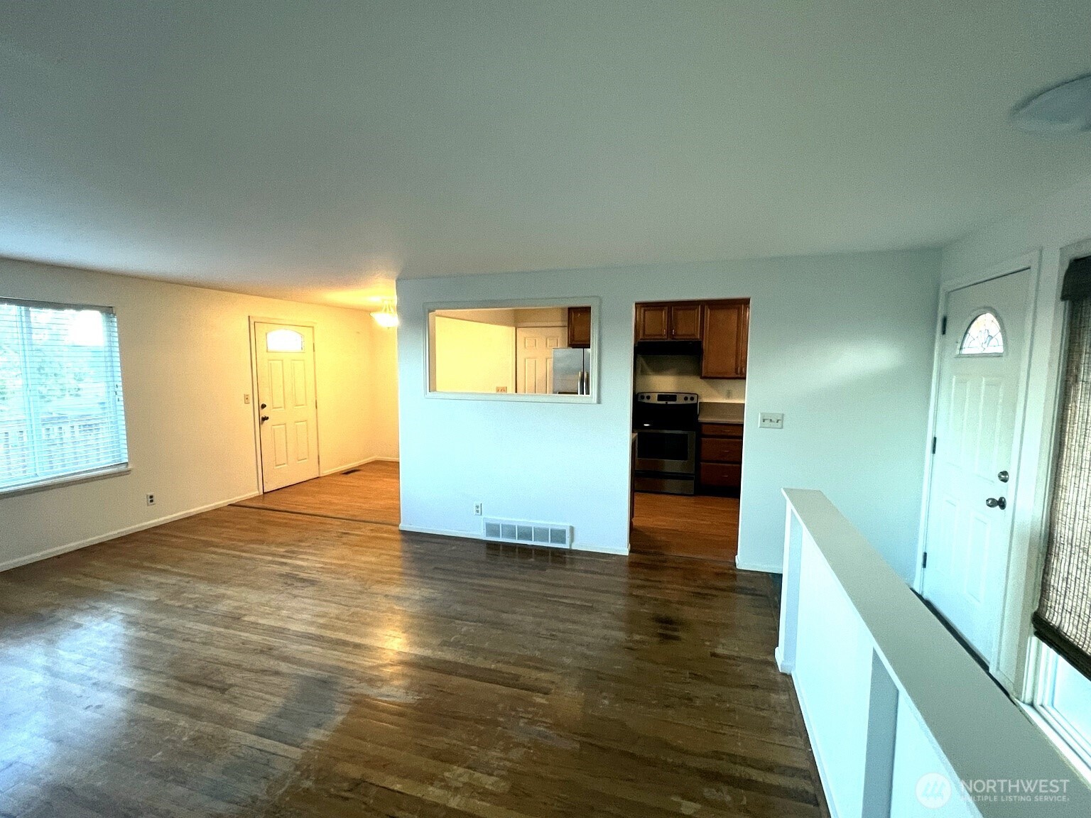 17930 Military Road South SeaTac, WA 98188 - Photo 5 of 19 an empty room with wooden floor and windows
