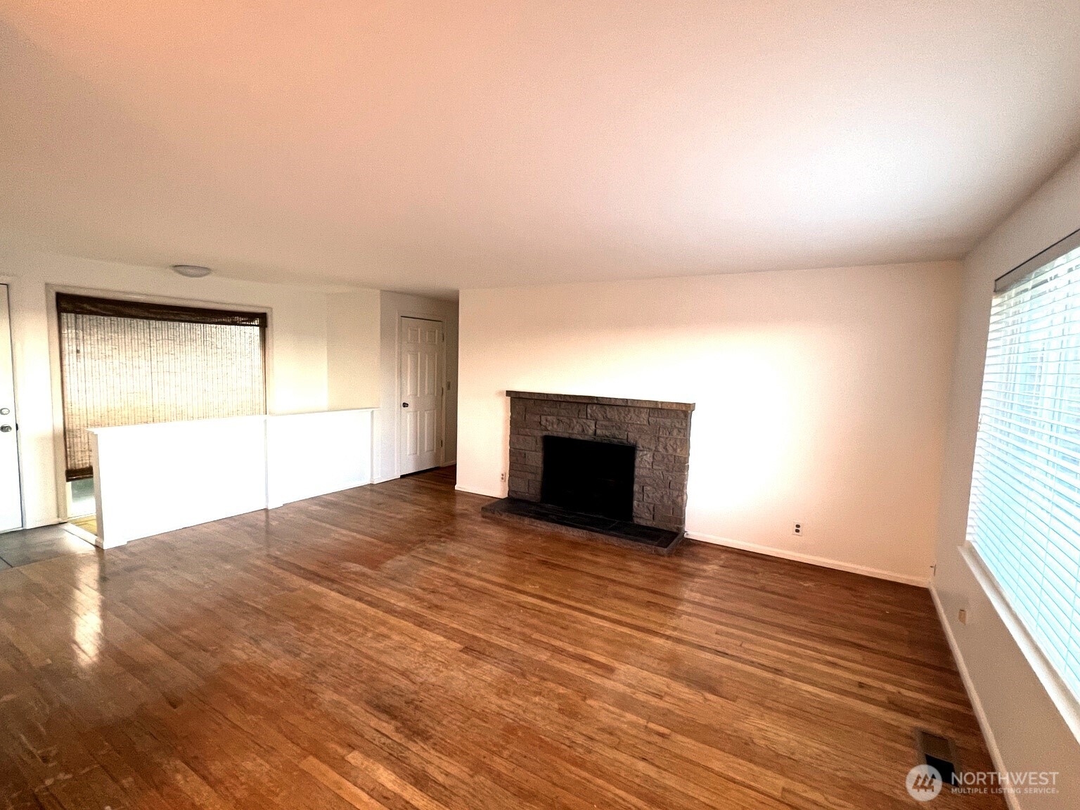 17930 Military Road South SeaTac, WA 98188 - Photo 9 of 19 an empty room with wooden floor and windows
