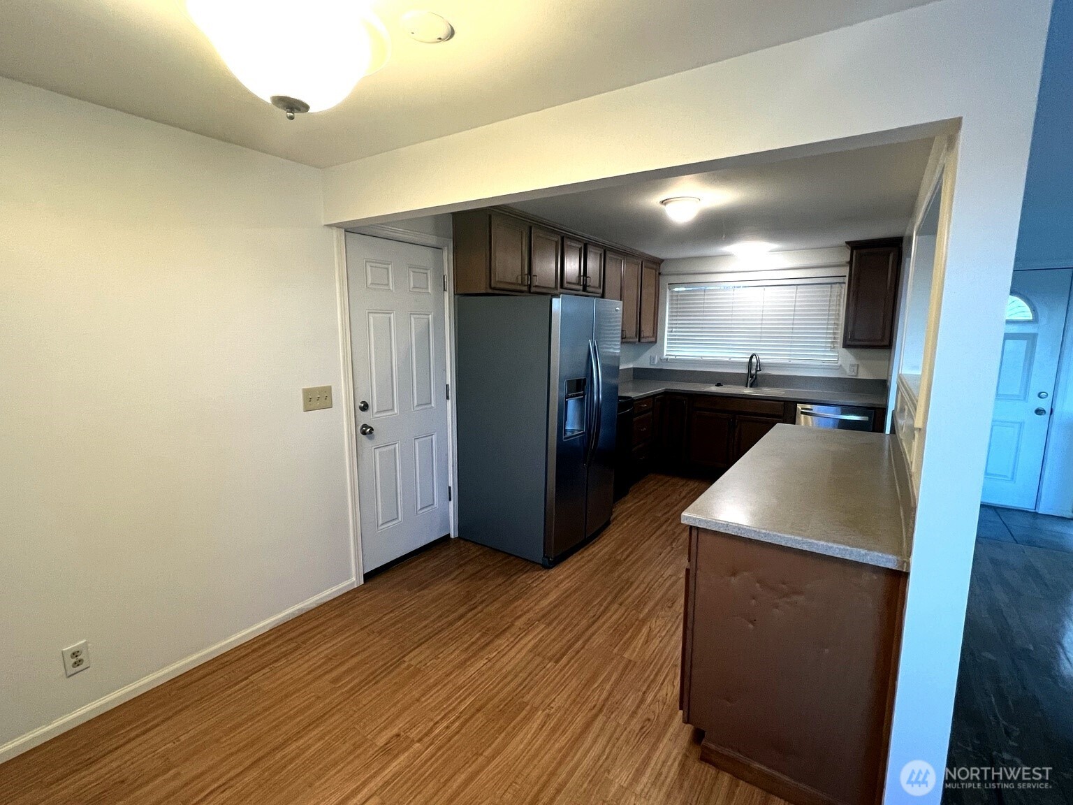17930 Military Road South SeaTac, WA 98188 - Photo 10 of 19 a view of a refrigerator in kitchen and wooden floor