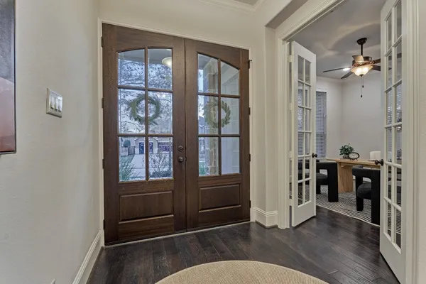 a view of a dining room with furniture wooden floor and chandelier